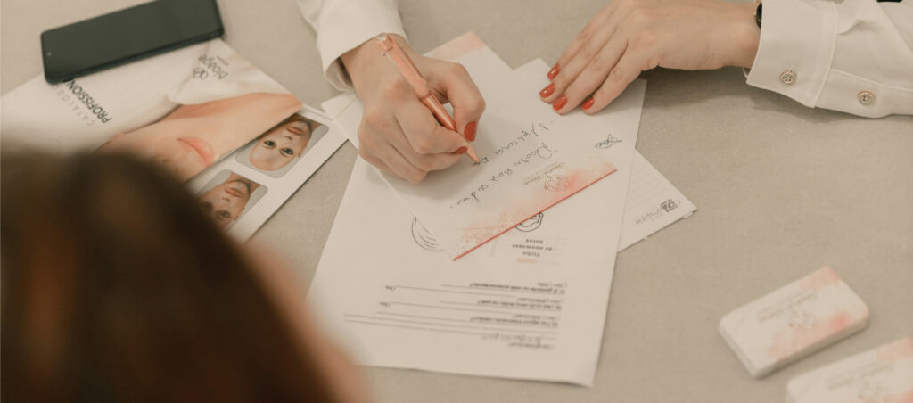 Nutrition consultant writing personalized fertility and preconception notes during a client intake session